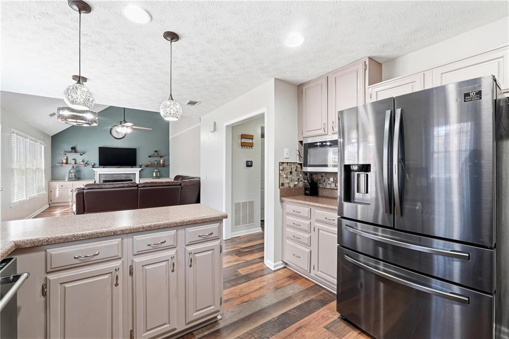 2964 Abbotts Oak Way Duluth, GA 30097 - Photo 17 of 29 a kitchen with stainless steel appliances a refrigerator sink and microwave