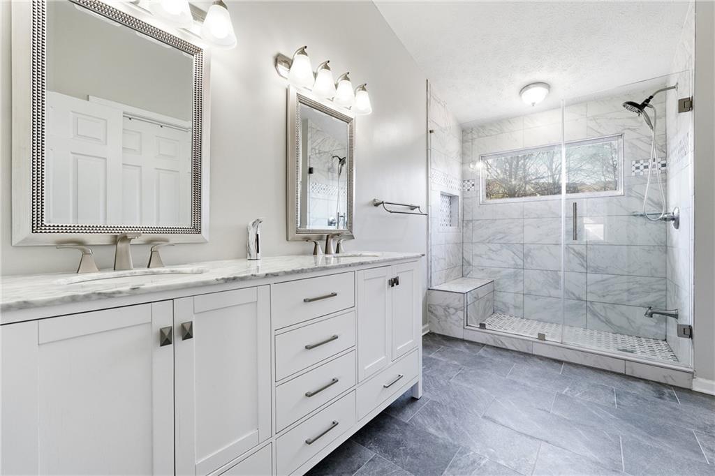 2964 Abbotts Oak Way Duluth, GA 30097 - Photo 22 of 29 a bathroom with double sink and a shower