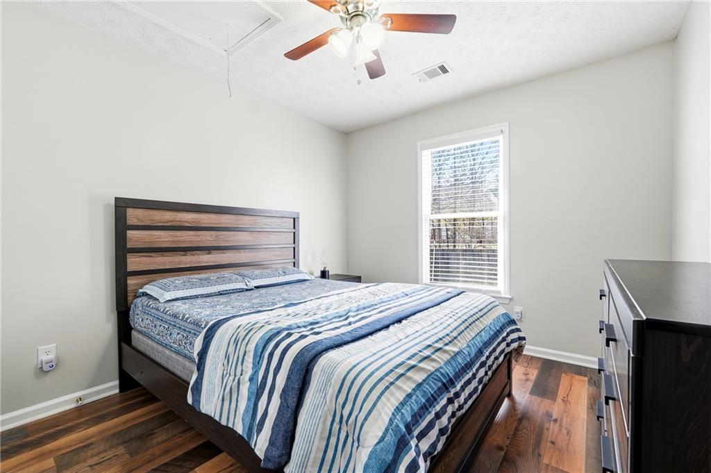 2964 Abbotts Oak Way Duluth, GA 30097 - Photo 25 of 29 a bedroom with a bed and a window