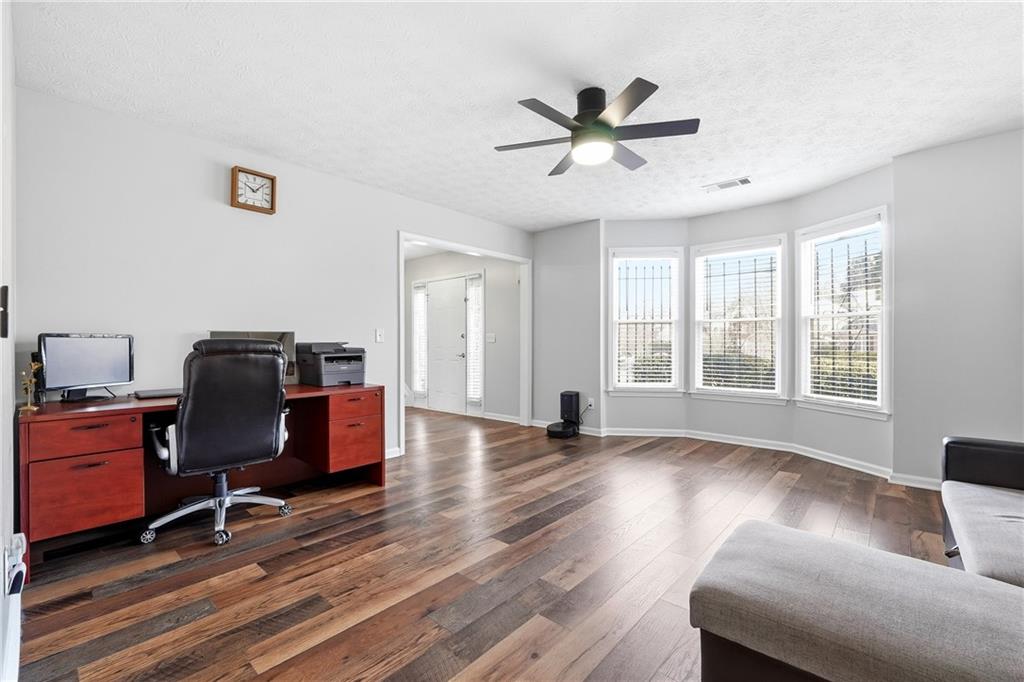 2964 Abbotts Oak Way Duluth, GA 30097 - Photo 5 of 29 a living room with furniture and a window