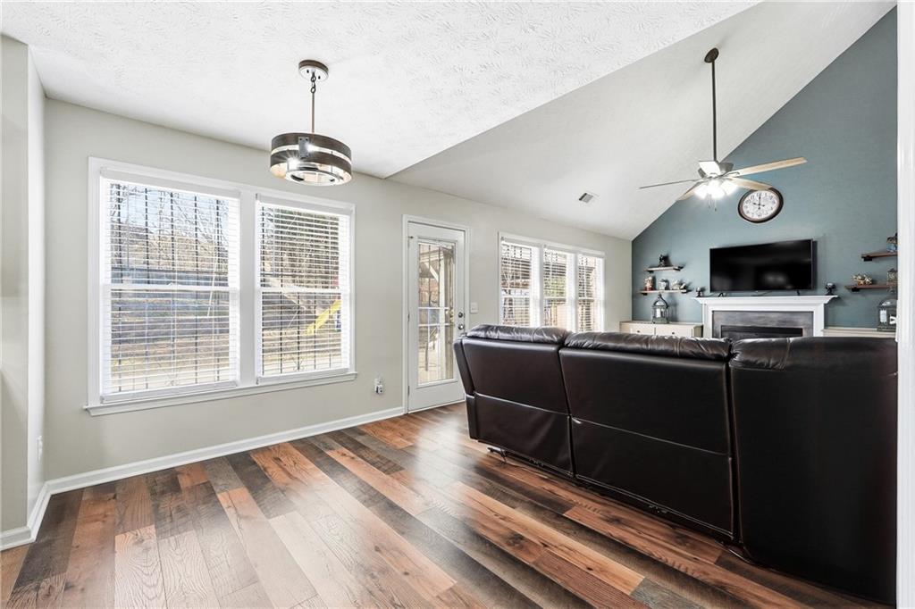 2964 Abbotts Oak Way Duluth, GA 30097 - Photo 10 of 29 a living room with furniture windows and flat screen tv