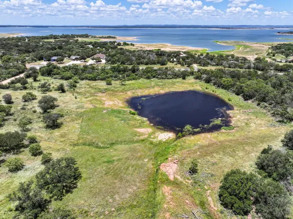 a view of a lake in front of a house
