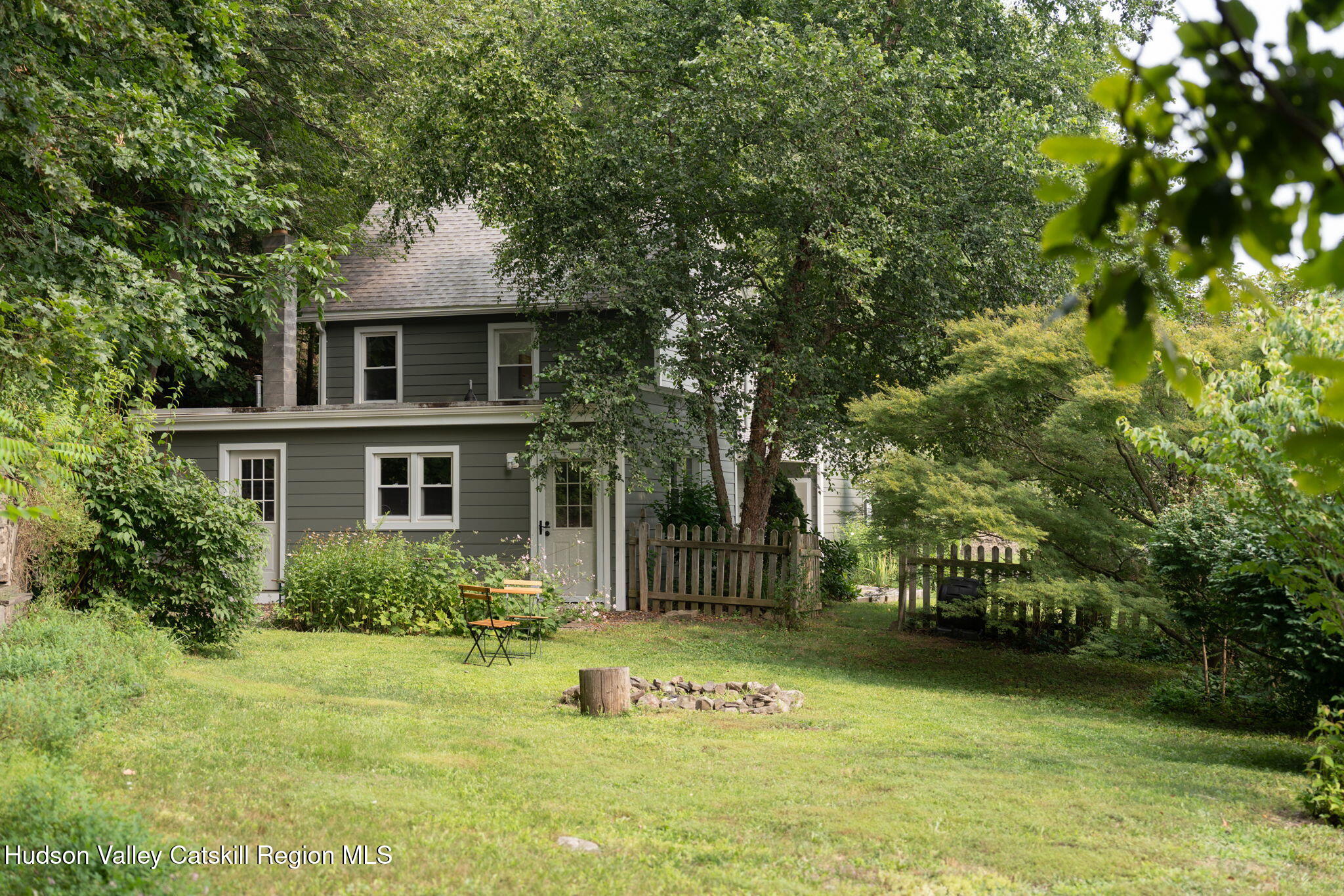 442 Lapla Road Kingston, NY 12401 - Photo 3 of 26 a front view of a house with a garden