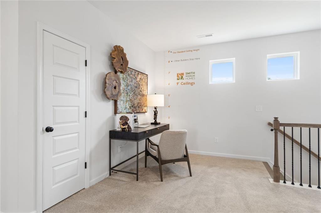 80 Cove Road Ringgold, GA 30736 - Photo 20 of 37 a view of a hallway that has a table and a chair with wooden floor
