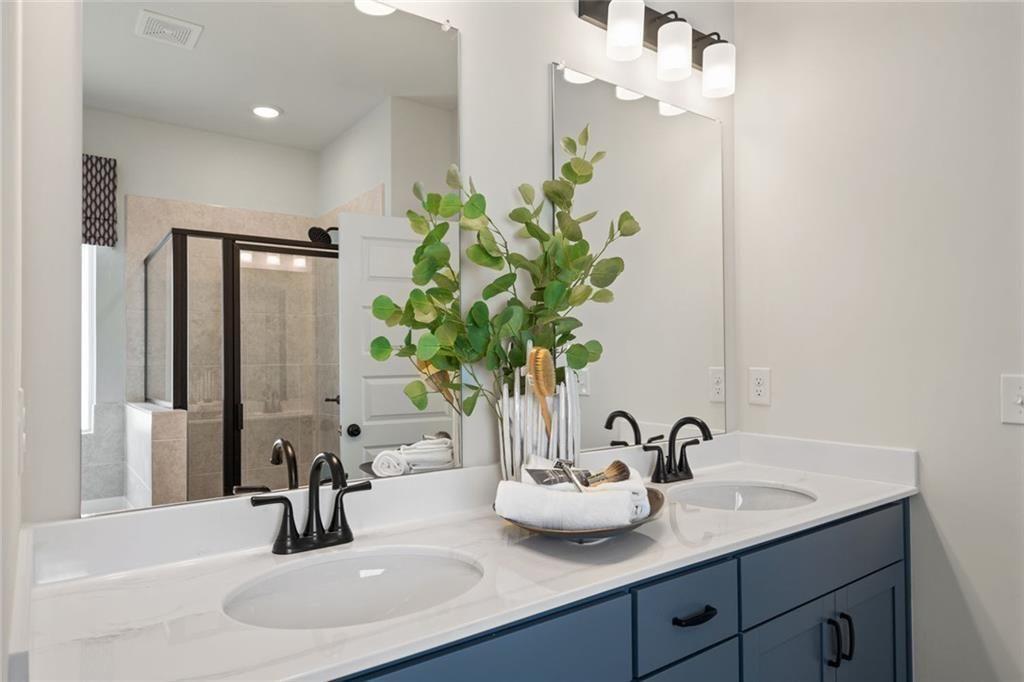 80 Cove Road Ringgold, GA 30736 - Photo 31 of 37 a bathroom with a sink and a mirror
