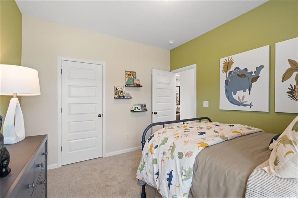 80 Cove Road Ringgold, GA 30736 - Photo 36 of 37 a bedroom with a bed and a lamp on the dresser