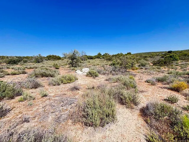 a view of a large body of water with a building in the background
