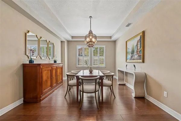 a view of an entryway with wooden floor and a livingroom view