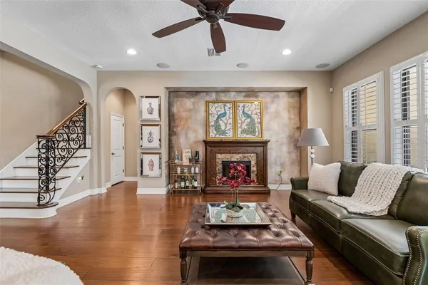 a living room with furniture and a large window