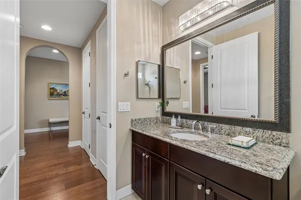 a view of a dining room with furniture wooden floor and a chandelier