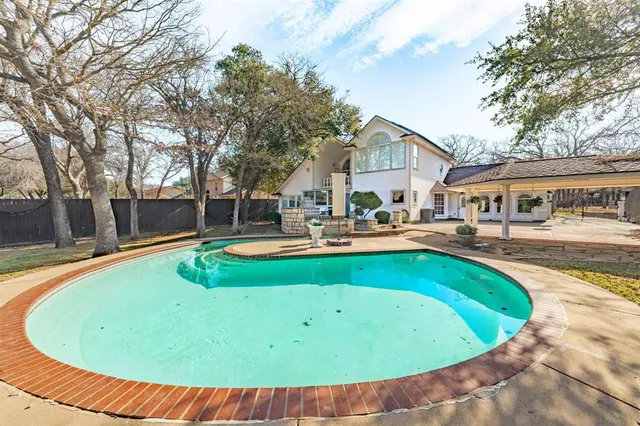 a view of a house with swimming pool