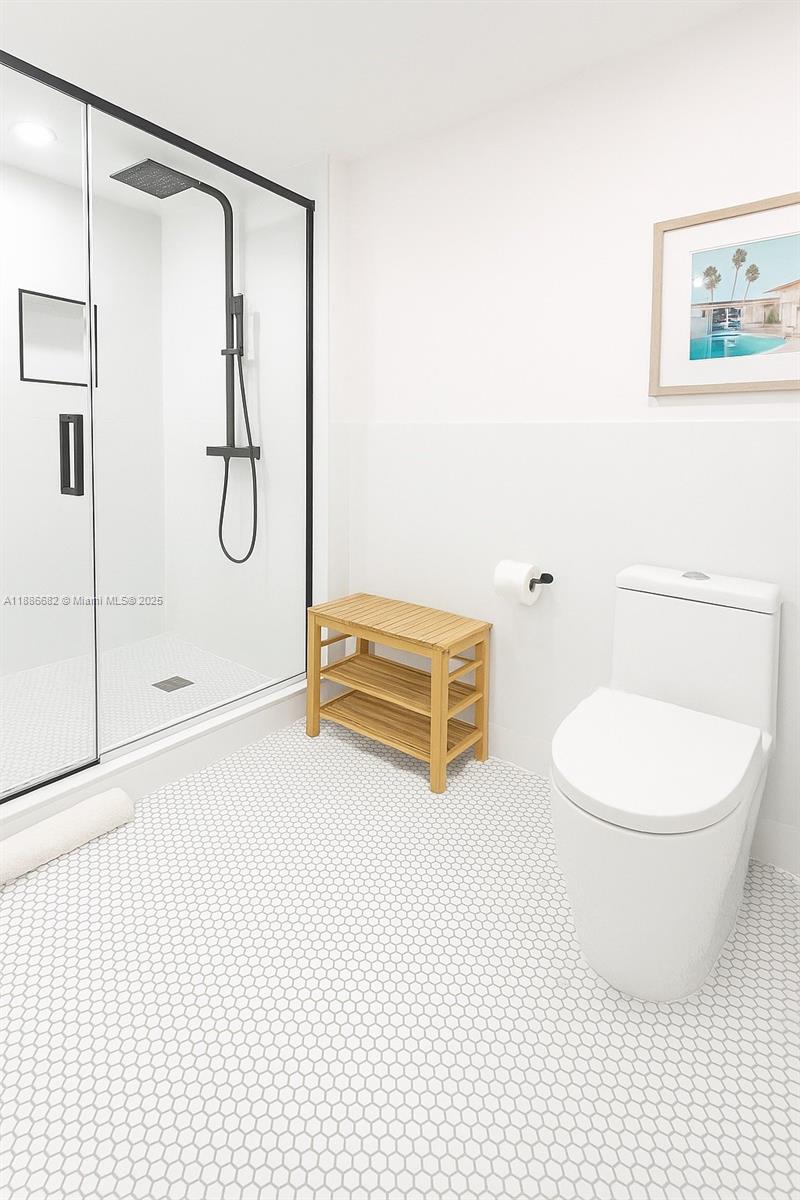 199 Ocean Ln Drive, Unit 115 Key Biscayne, FL 33149 - Photo 11 of 24 a bathroom with a toilet a sink and shower