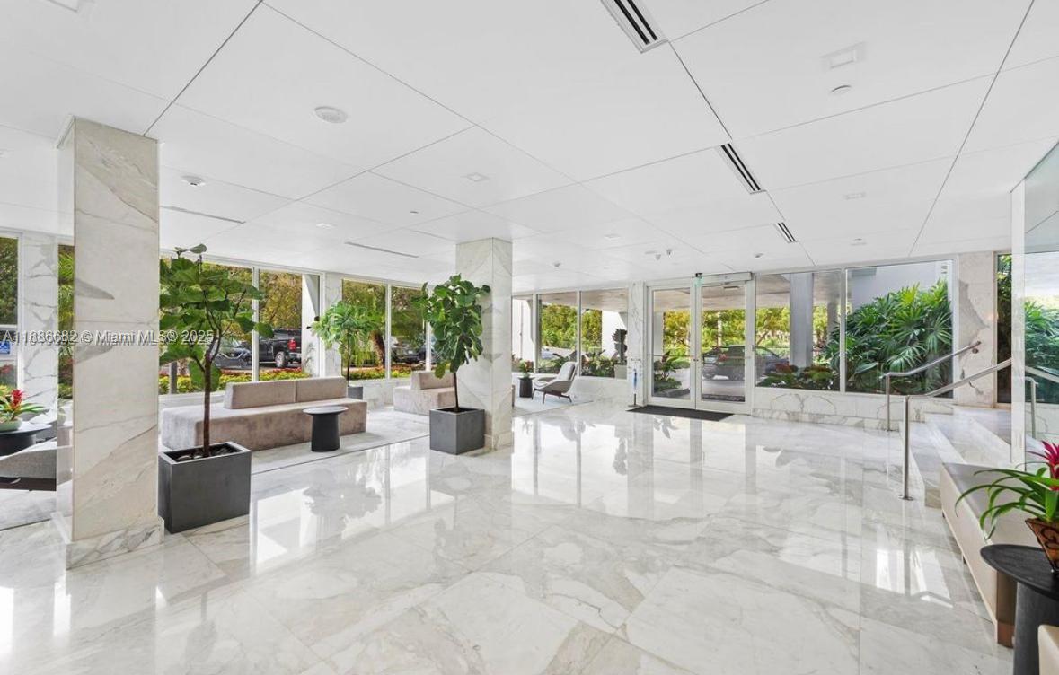 199 Ocean Ln Drive, Unit 115 Key Biscayne, FL 33149 - Photo 16 of 24 a view of an entryway with floor to ceiling windows and outdoor space