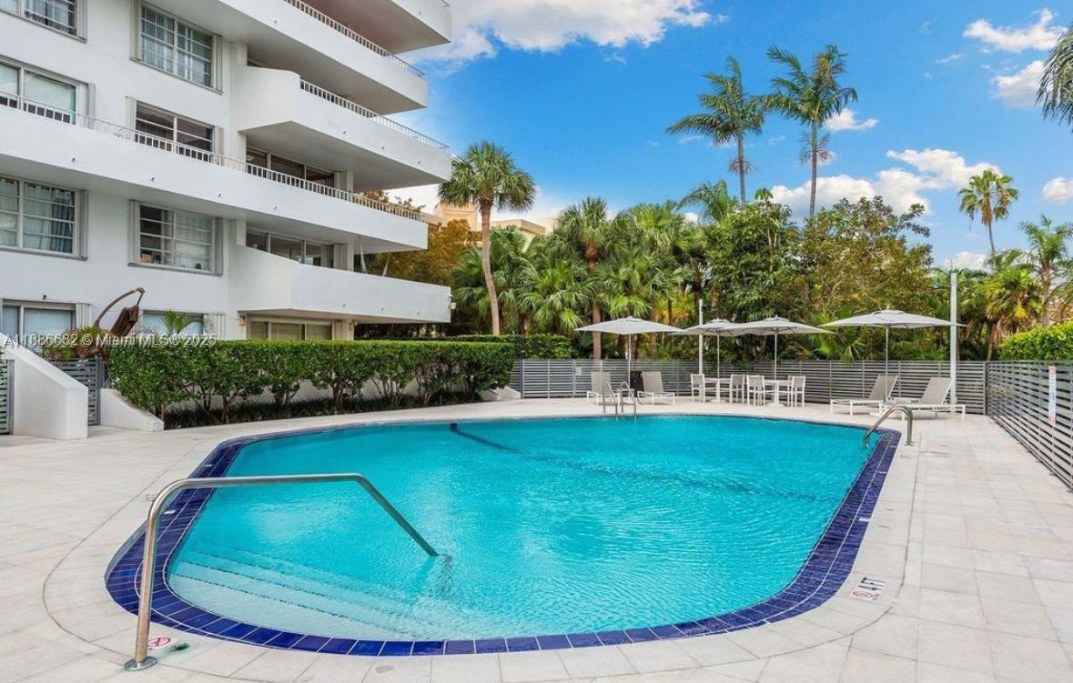 199 Ocean Ln Drive, Unit 115 Key Biscayne, FL 33149 - Photo 17 of 24 a view of a swimming pool with a garden