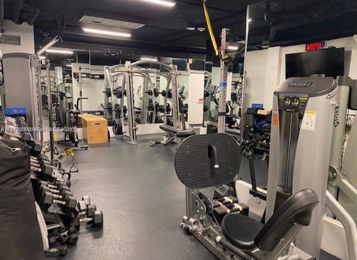 199 Ocean Ln Drive, Unit 115 Key Biscayne, FL 33149 - Photo 21 of 24 a room with gym equipment