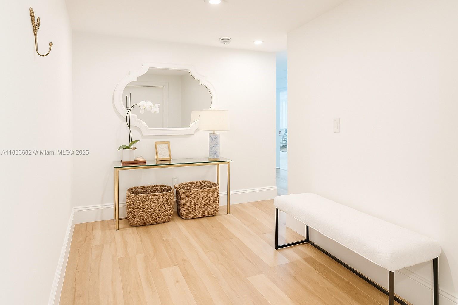 199 Ocean Ln Drive, Unit 115 Key Biscayne, FL 33149 - Photo 3 of 24 a living room with furniture and a mirror