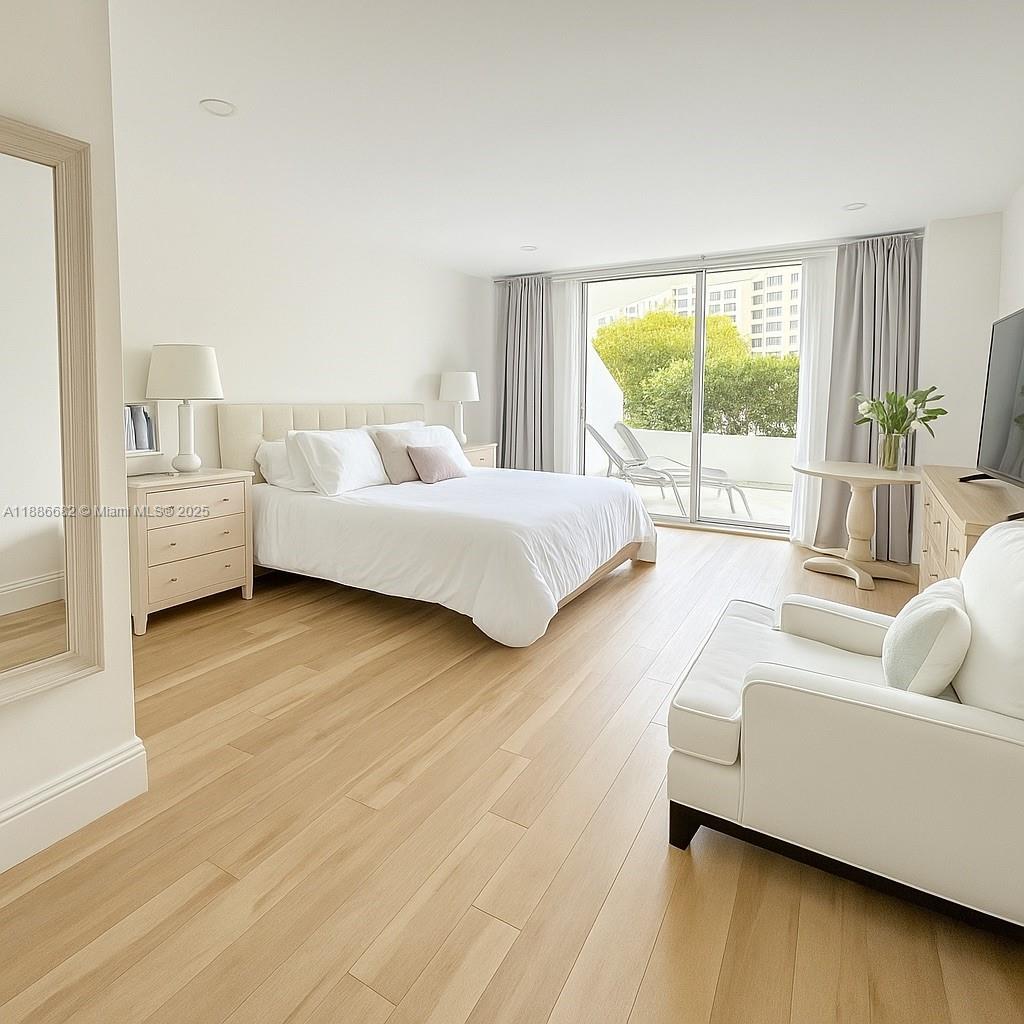 199 Ocean Ln Drive, Unit 115 Key Biscayne, FL 33149 - Photo 7 of 24 a living room with furniture and a large window