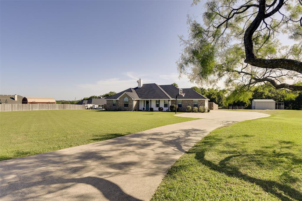 1530 Rutherford Road Waxahachie, TX 75165 - Photo 1 of 1 View of front facade featuring driveway with extra parking and view of the barn