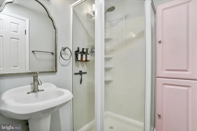 a bathroom with a sink and mirror