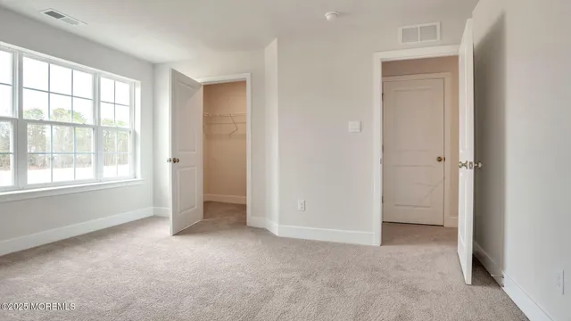 a bathroom with a sink double vanity and a mirror
