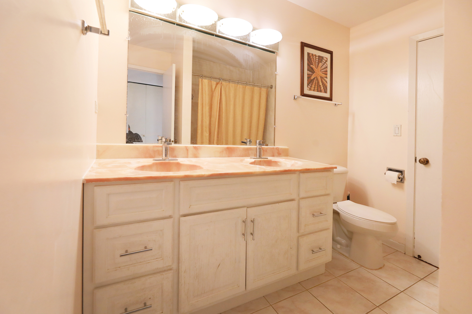 317 Partridge Lane Wheeling, IL 60090 - Photo 14 of 22 a bathroom with a sink a toilet and mirror