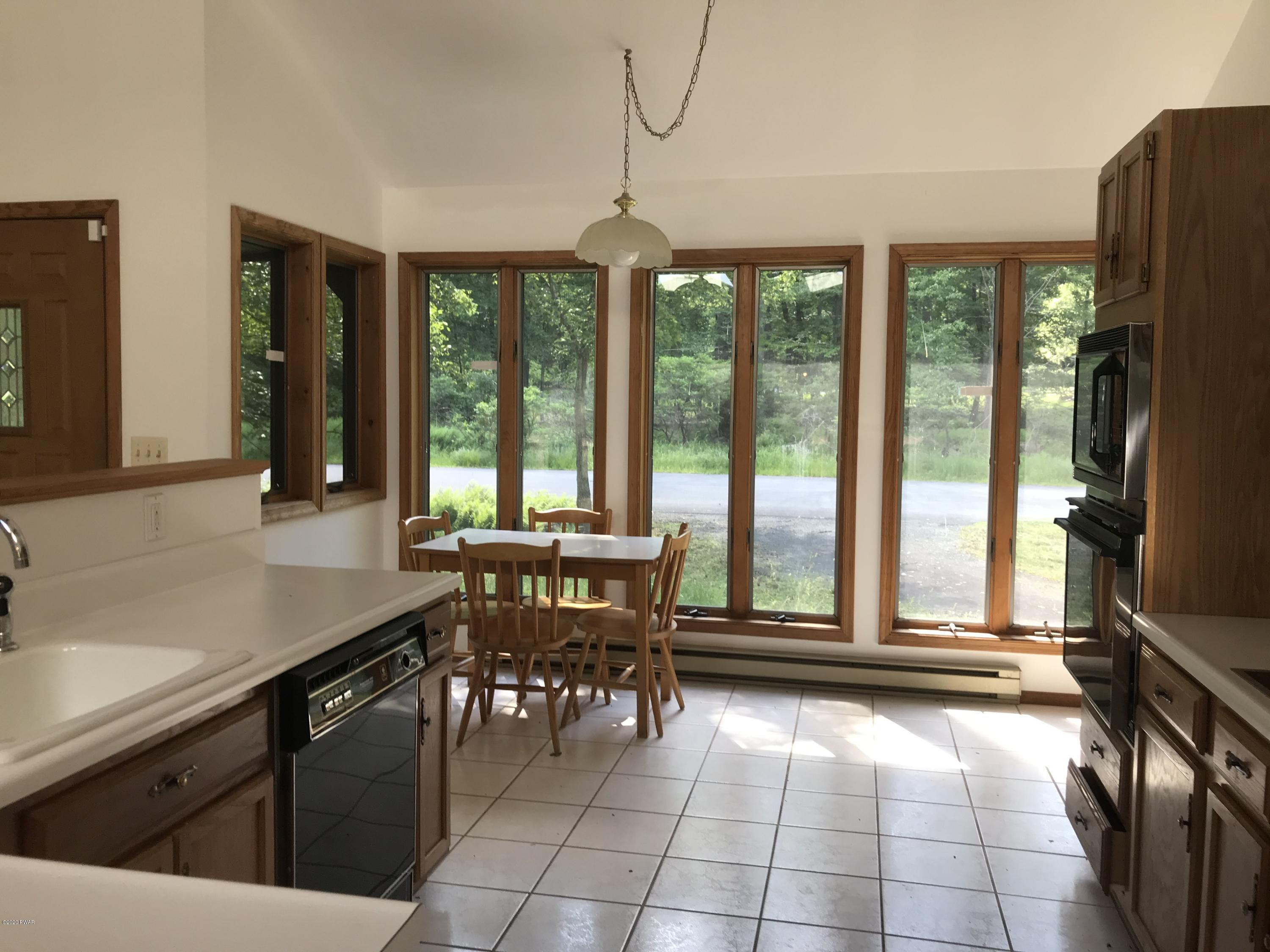 183 Yale Road Milford, PA 18337 - Photo 25 of 26 a kitchen with a sink a counter top space and stainless steel appliances