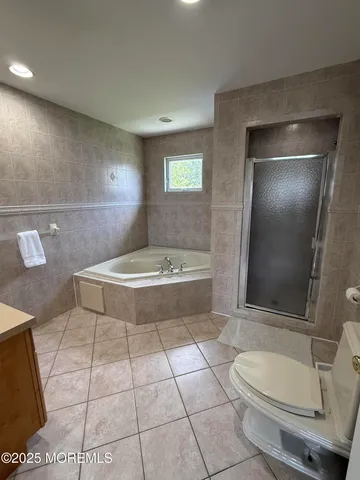 a bathroom with a bathtub and a toilet