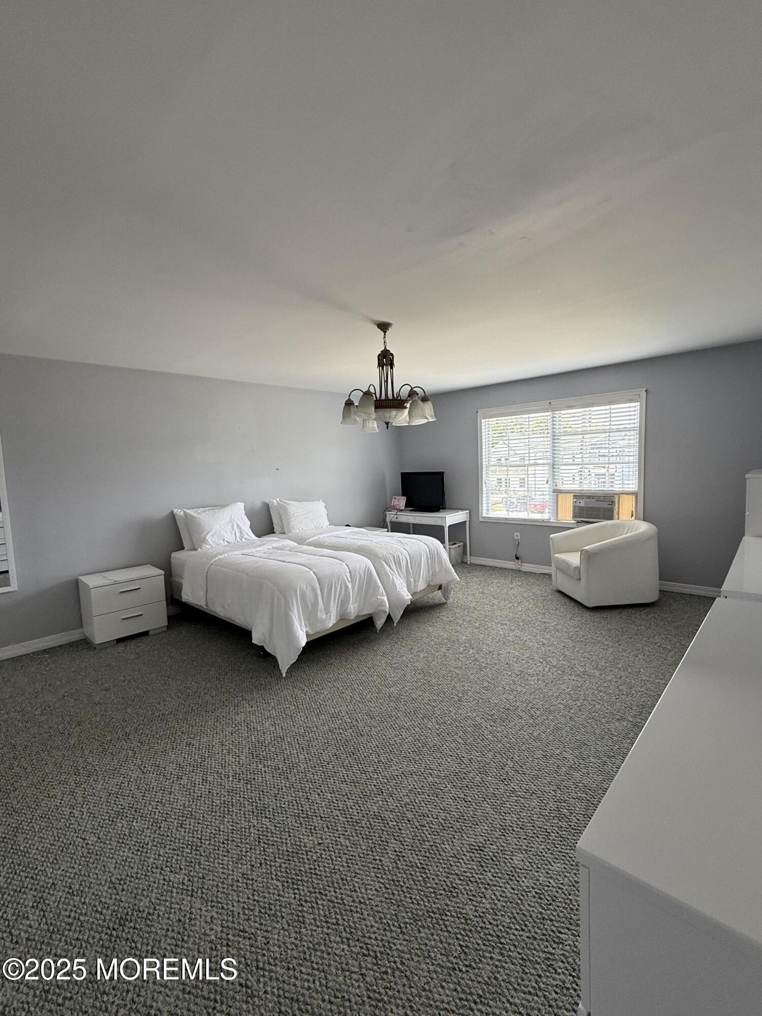 519 2nd Avenue Long Branch, NJ 07740 - Photo 12 of 24 a bed room with a bed and a couch
