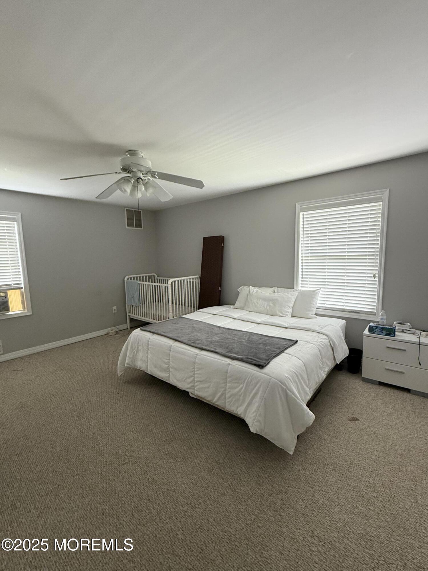 519 2nd Avenue Long Branch, NJ 07740 - Photo 15 of 24 a bedroom with bed and window
