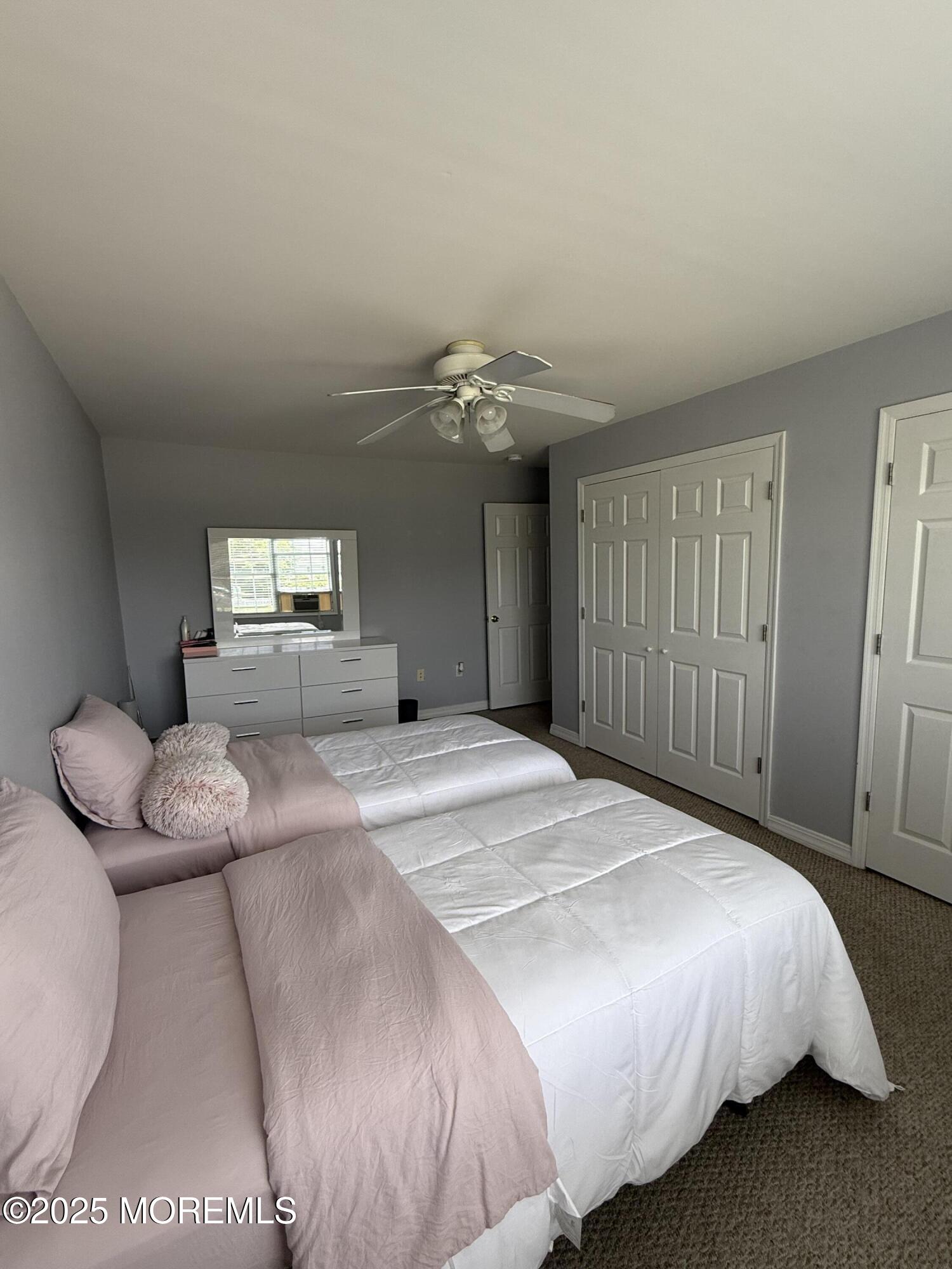 519 2nd Avenue Long Branch, NJ 07740 - Photo 17 of 24 a spacious bedroom with a bed and a dresser