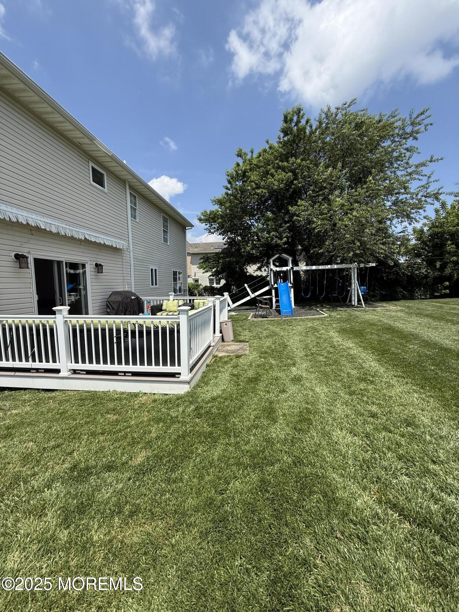 519 2nd Avenue Long Branch, NJ 07740 - Photo 21 of 24 a view of a house with a yard and sitting area
