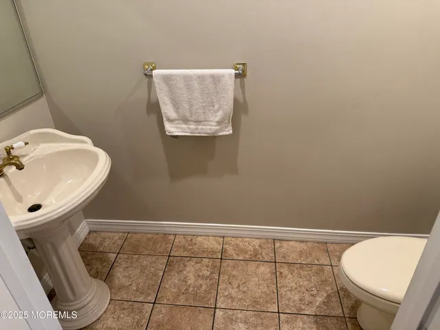 a bathroom with a toilet and a sink