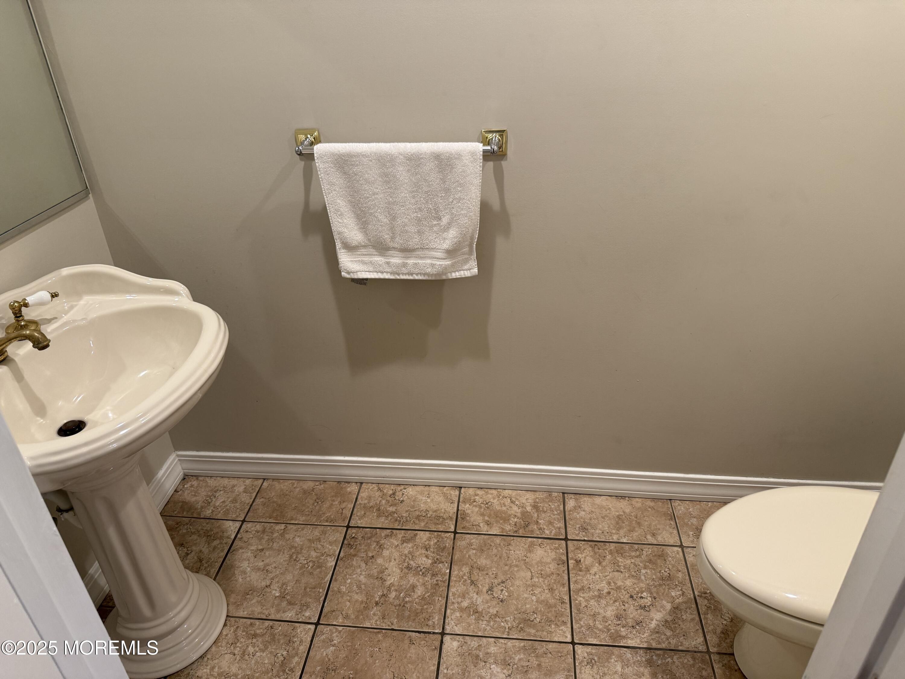 519 2nd Avenue Long Branch, NJ 07740 - Photo 24 of 24 a bathroom with a toilet and a sink
