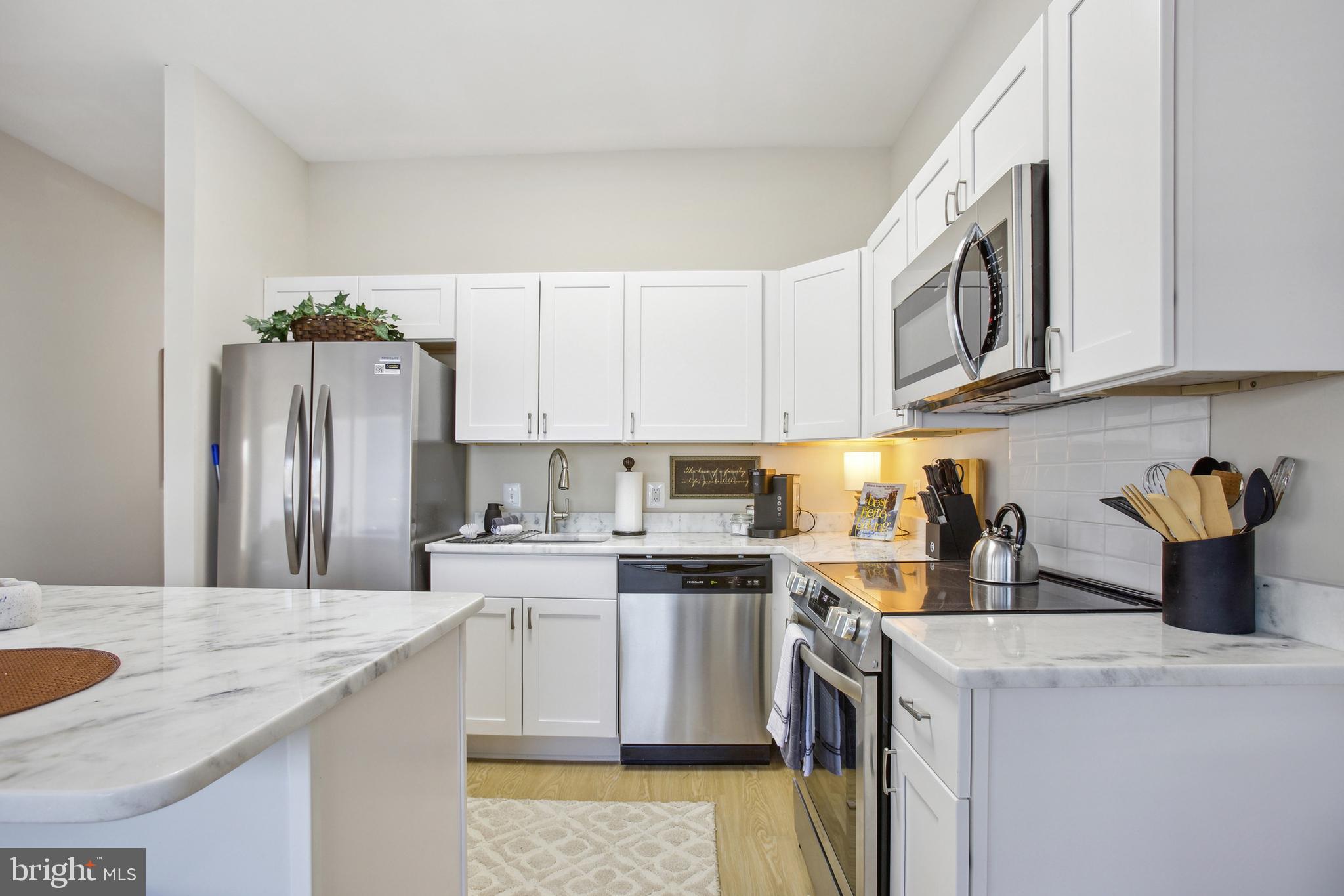 1900 Princess Anne Street, Unit 6 Fredericksburg, VA 22401 - Photo 12 of 19 a kitchen with a sink a stove and cabinets