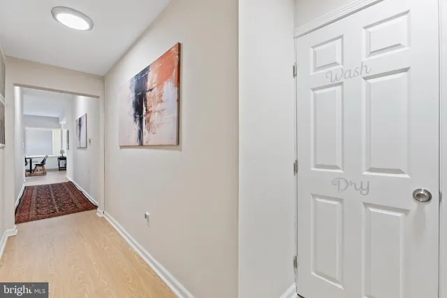 a view of a hallway view with wooden floor and staircase
