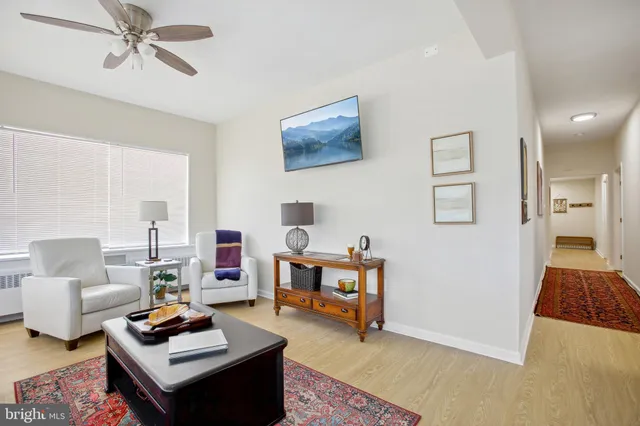 a living room with furniture and a table