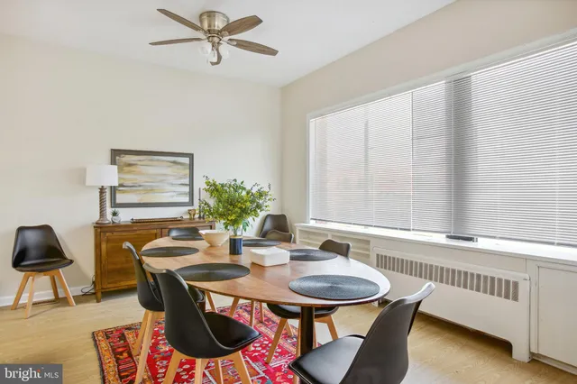 a view of a dining room with furniture and window