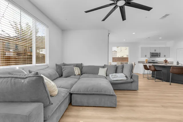 a living room with furniture and a large window
