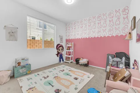 a bedroom with a bed and a table in it