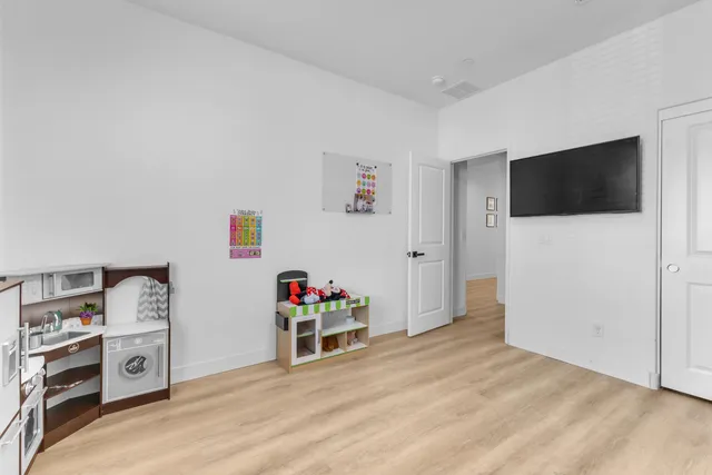 a view of a livingroom with a flat screen tv