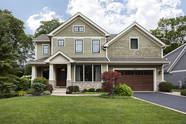 2246 Illinois Road Northbrook, IL 60062 - Photo 1 of 25 a front view of a house with a garden and yard