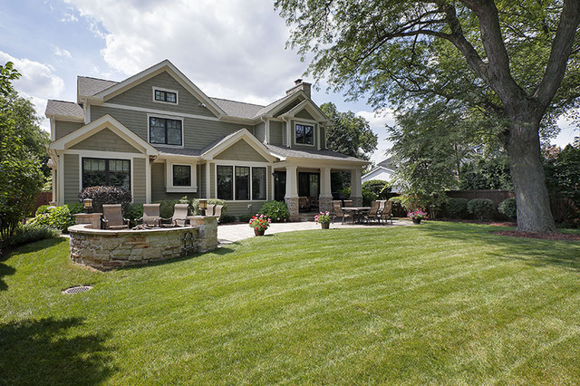 2246 Illinois Road Northbrook, IL 60062 - Photo 2 of 25 a front view of a house with swimming pool and green space