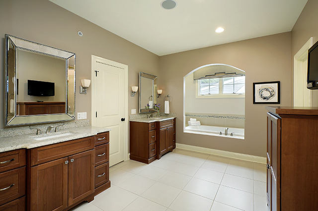 2246 Illinois Road Northbrook, IL 60062 - Photo 11 of 25 a bathroom with a granite countertop sink mirror and bathtub