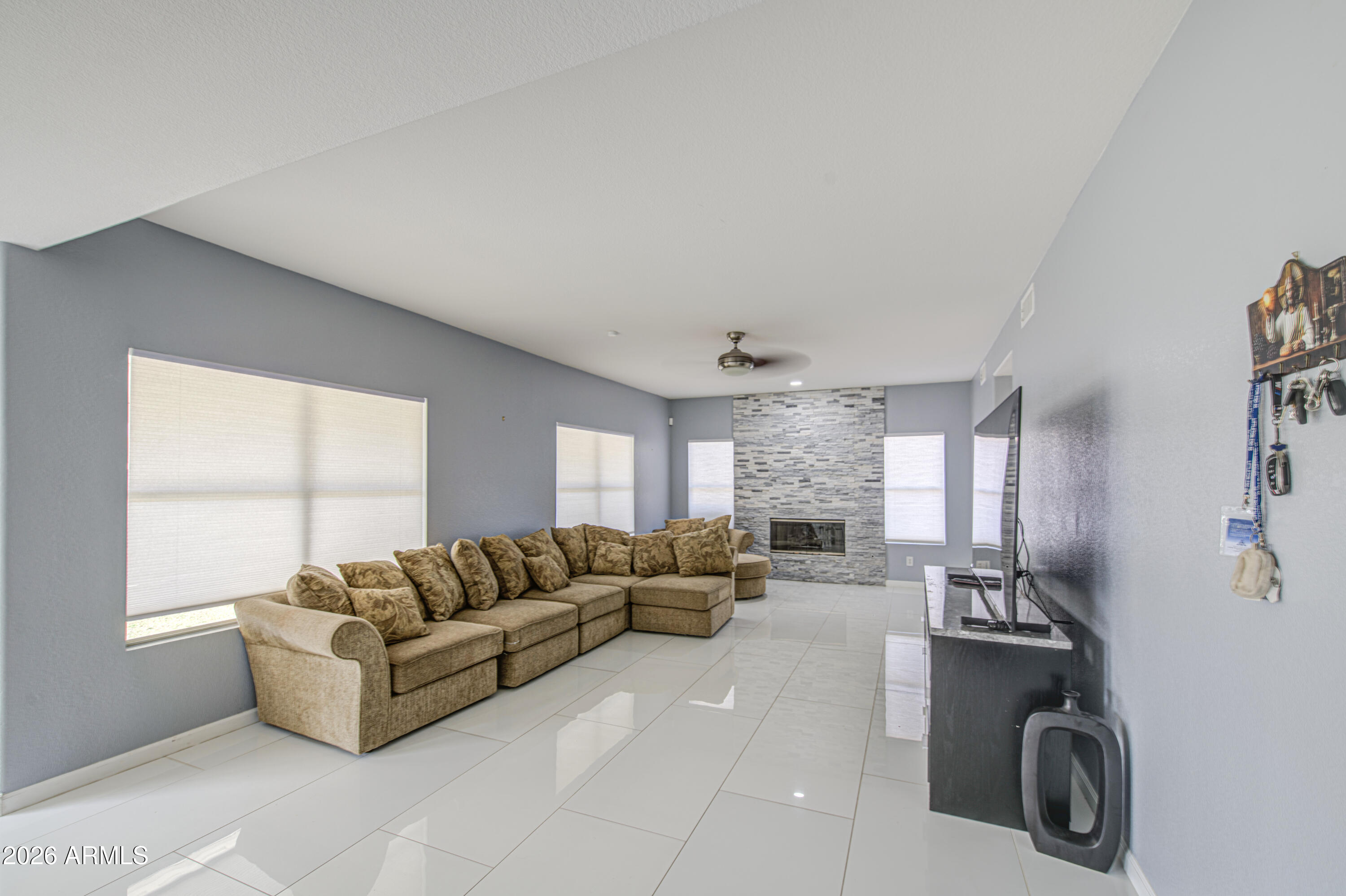 12403 West Monte Vista Road Avondale, AZ 85392 - Photo 14 of 63 a living room with furniture and a large window