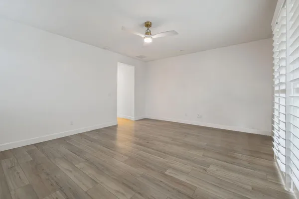 a view of an empty room with a window