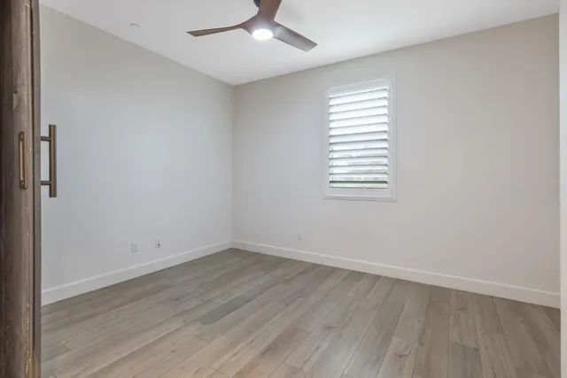 a view of swimming pool with outdoor seating and yard in the back
