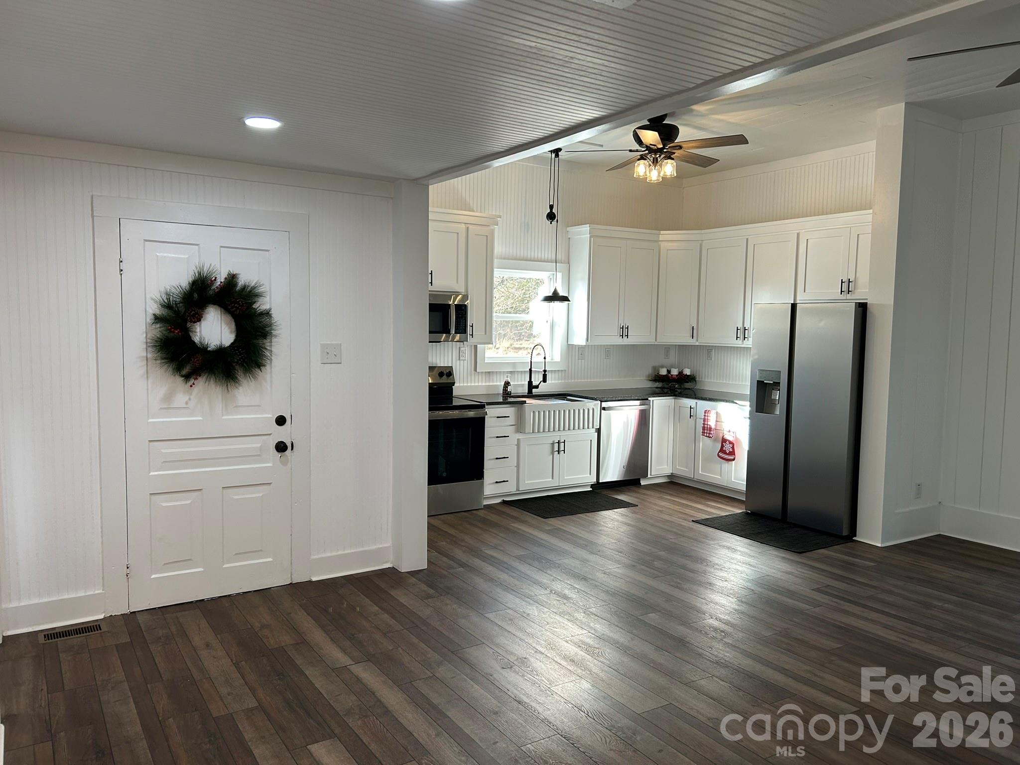 464 Hamrick Road Mooresboro, NC 28114 - Photo 19 of 47 a kitchen with stainless steel appliances a refrigerator sink and cabinets