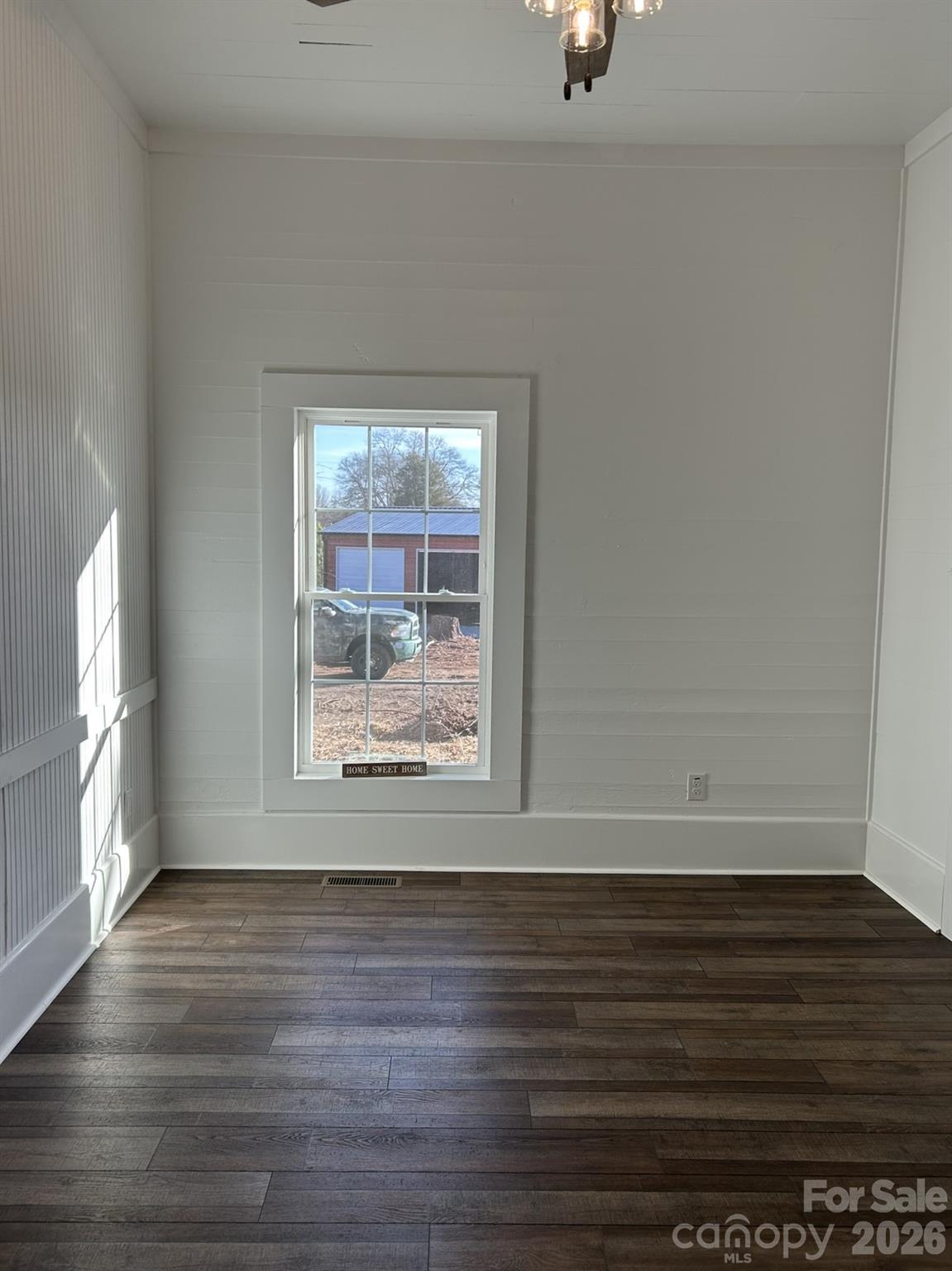 464 Hamrick Road Mooresboro, NC 28114 - Photo 28 of 47 a view of an empty room with wooden floor and a window