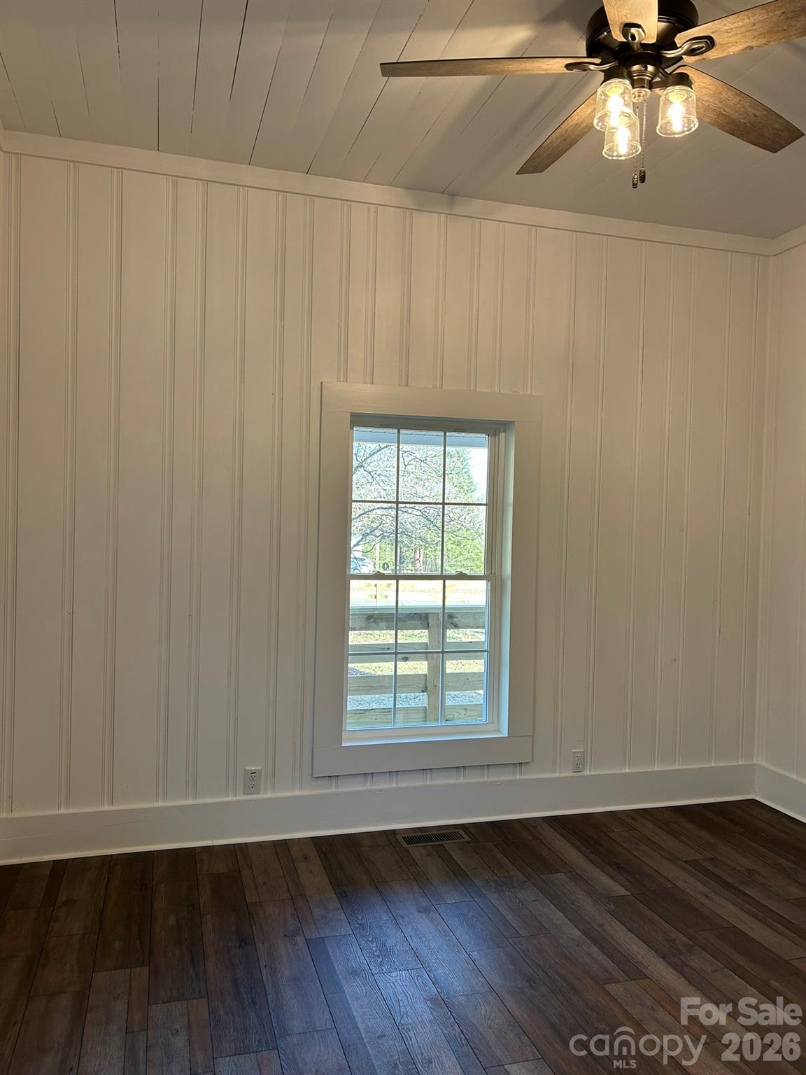 464 Hamrick Road Mooresboro, NC 28114 - Photo 33 of 47 a view of an empty room with a window and wooden floor