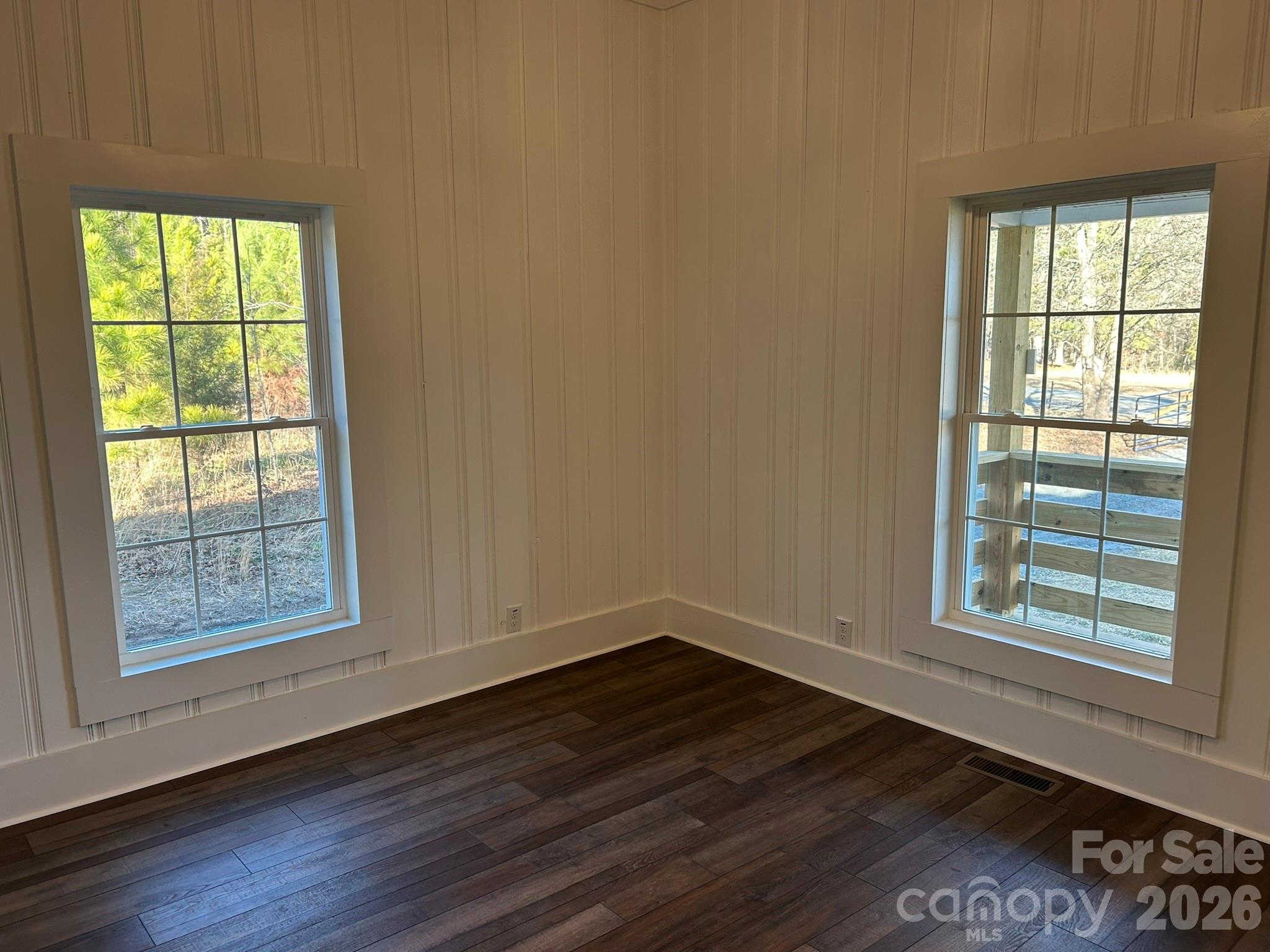464 Hamrick Road Mooresboro, NC 28114 - Photo 34 of 47 an empty room with wooden floor and windows